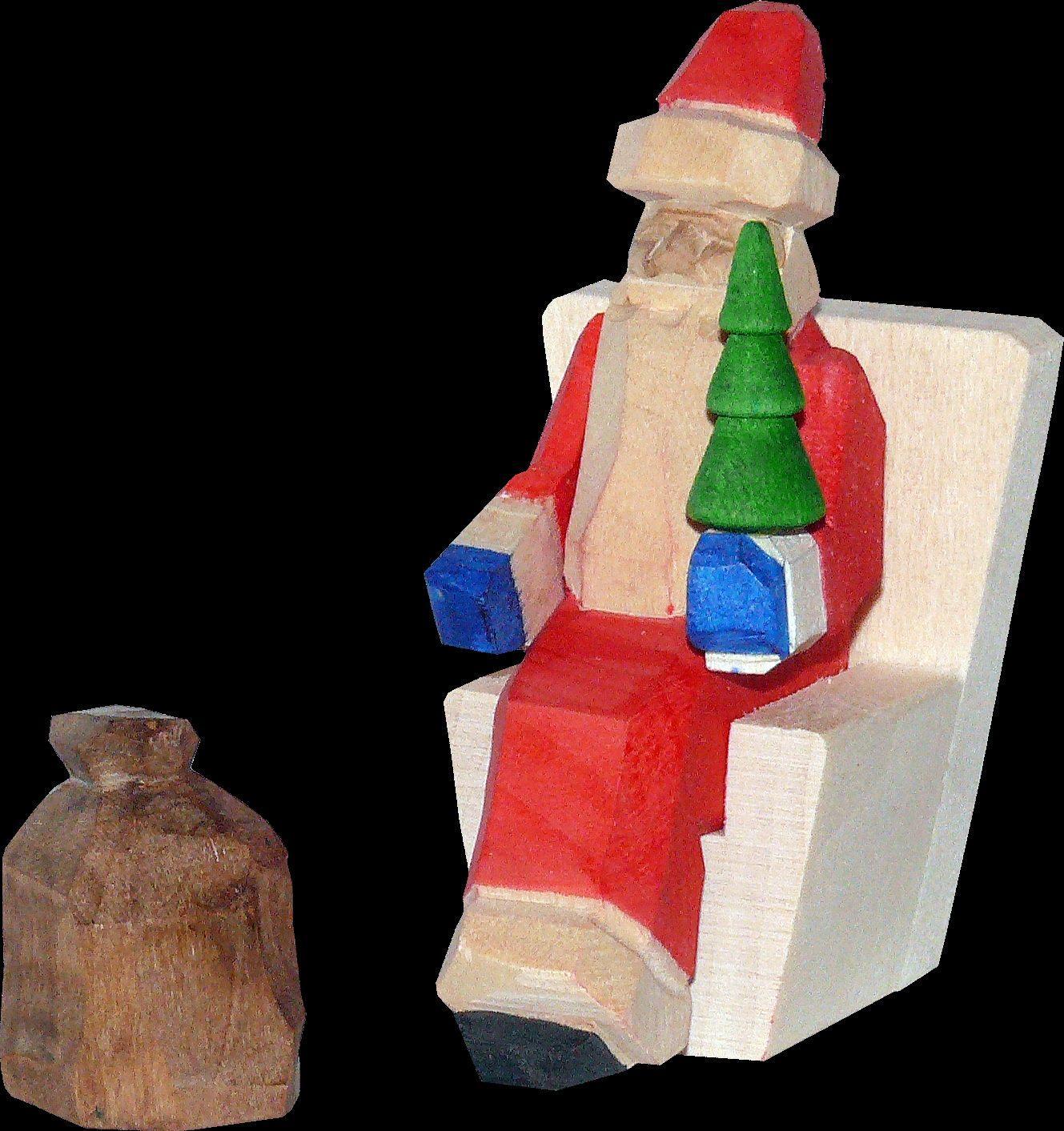 Miniatur &ndash; liebevoll geschnitzter Weihnachtsmann im detailreichen Holzsessel, bunt bemalt mit Geschenkesack &ndash; BxHxT = 4 x 6 x 4 cm