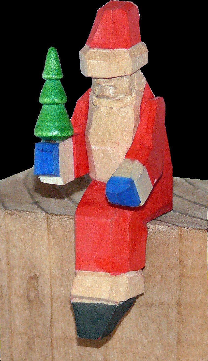 Kantenhocker &ndash; detailreicher Weihnachtsmann mit Geschenk und rotem Mantel, mehrfarbig handbemalt &ndash; BxHxT = 2 x 6 x 3 cm