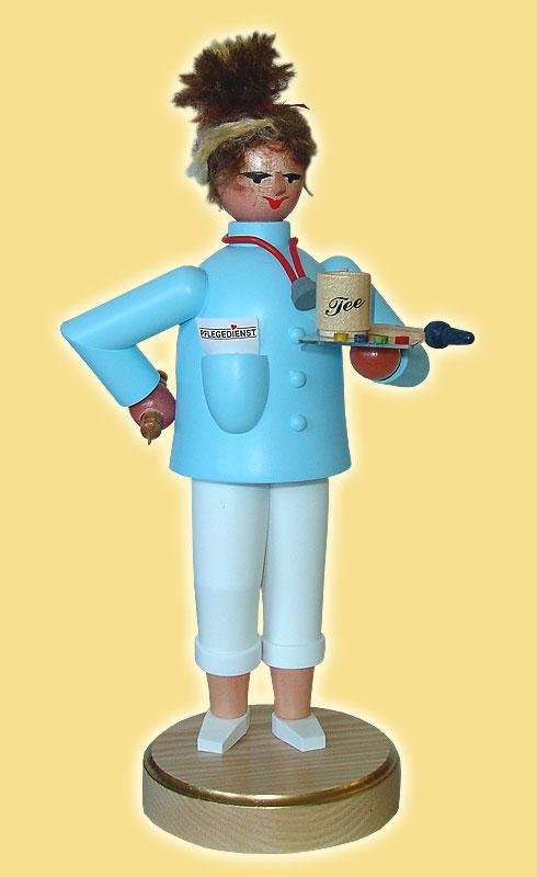 R&auml;ucherfrau &ndash; detailreiche Altenpflegerin mit Tablett, Spritze und hellblauem Kittel &ndash; HxBxT = 22 x 11 x 9 cm