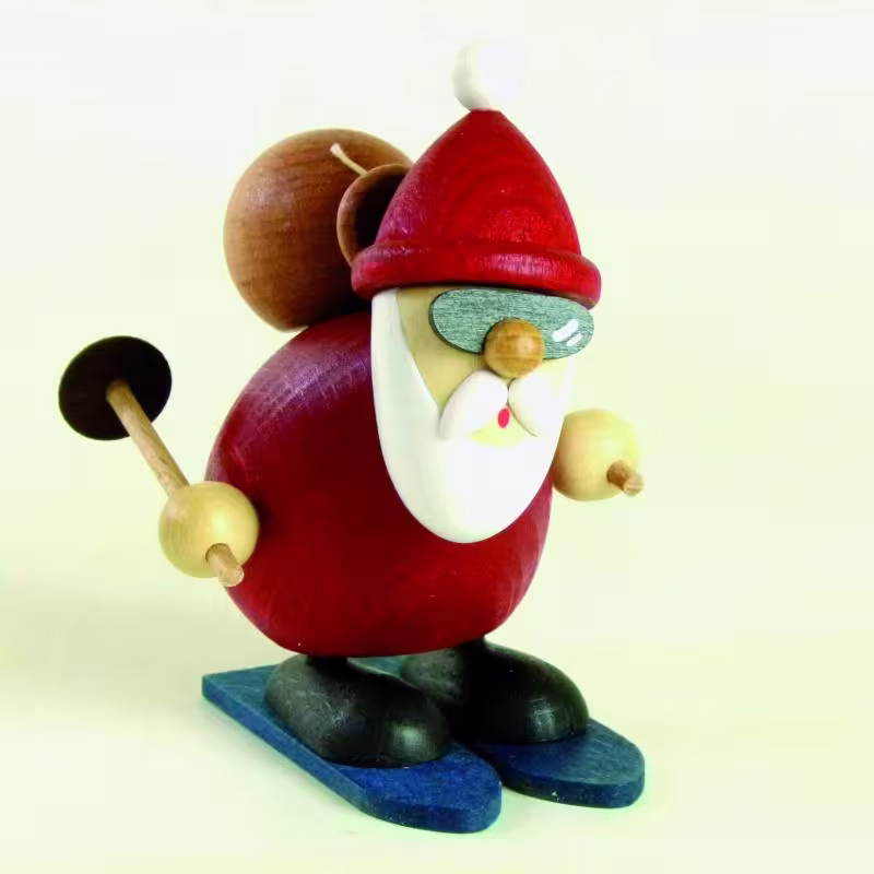 Holzfigur Weihnachtsmann auf Ski mit Mütze und Geschenkesack, farbenfroh gestaltet von Kunsthandwerk