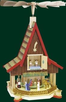 Tischpyramide – farbenfrohes Adventshaus mit Christi Geburt und drehenden Figuren aus Holz von
