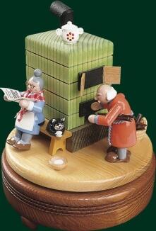 Spieluhr – liebevolle Szene am Kachelofen mit Oma, Opa und Katze, farbenfroh – spielt „Oh