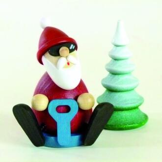 Räuchermann Weihnachtsmann mit Schneerutscher und Tannenbaum aus Holz, rot-weiß, von Kunsthandwerk