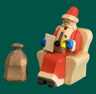 Räuchermann – gemütlicher Weihnachtsmann im roten Gewand mit Geschenkesack und Teetasse von